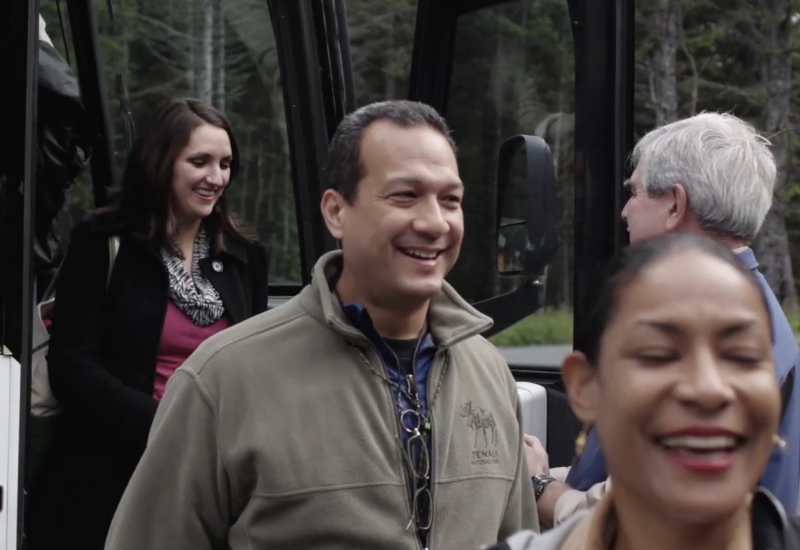 people getting off a bus