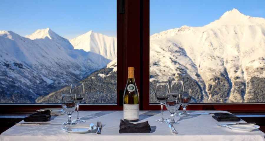 table with windows that show glaciers