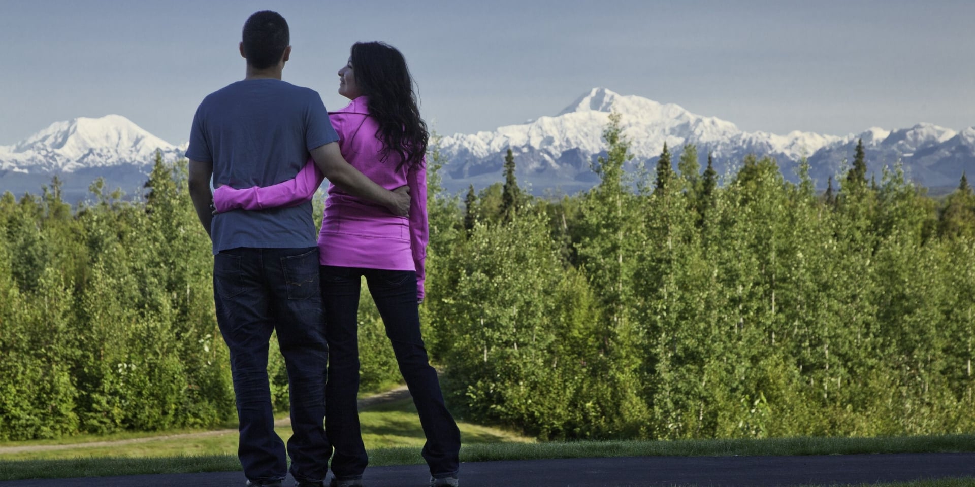 couple looking out to the forest